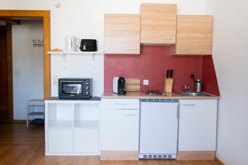 Kuchyň nebo kuchyňský kout v ubytování Marktlhaus Goldegg