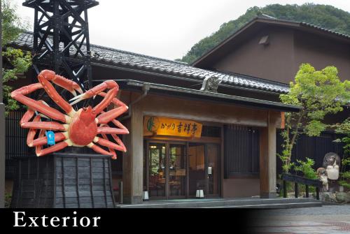a building with a sculpture of a lobster on it at Yamanaka Onsen Kagari Kisshotei in Kaga