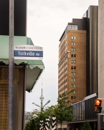 a view of a city with a tower in the background at Park Hyatt Toronto in Toronto