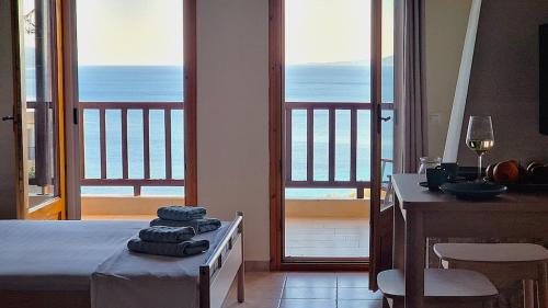 a room with a bed with a view of the ocean at Sunrise Studio 2 Afitos in Afitos