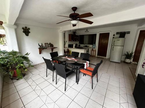 a kitchen and dining room with a table and chairs at Casa Mara Beachfront -Heated Pool in Sayulita