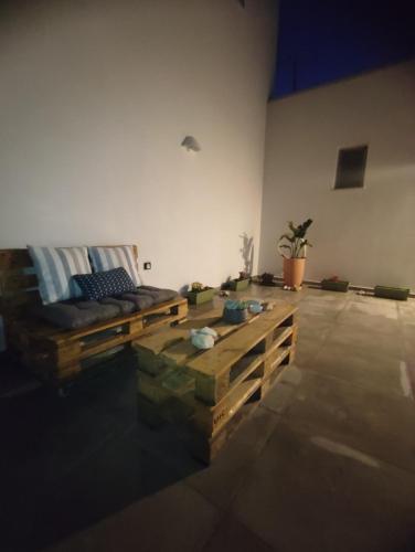 a living room with a couch and a table at Sifnaiou Apartment 2 in Parasporos