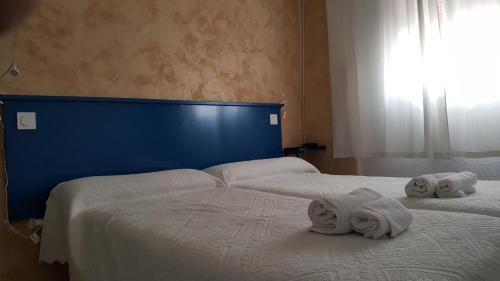 Postel nebo postele na pokoji v ubytování Giraldilla
