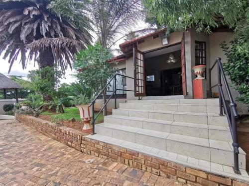 a set of stairs leading to a house at Catwalk Lodge in Pretoria