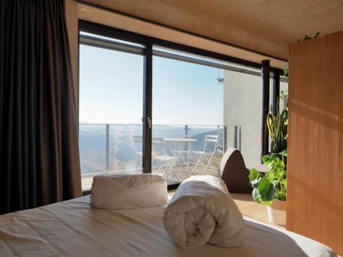 Ένα ή περισσότερα κρεβάτια σε δωμάτιο στο Qb Apartments