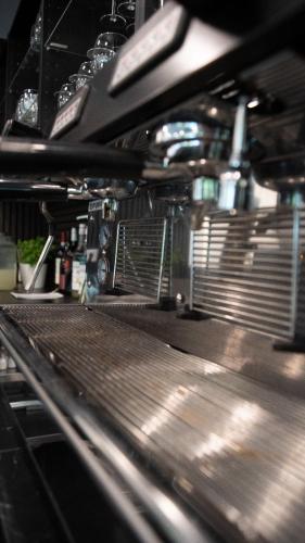 a close up of a metal conveyor belt at Boutique Hotel GreenLeaf in Sinzing