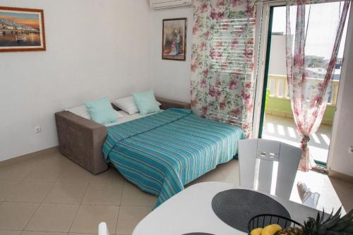 Ένα ή περισσότερα κρεβάτια σε δωμάτιο στο Gloria