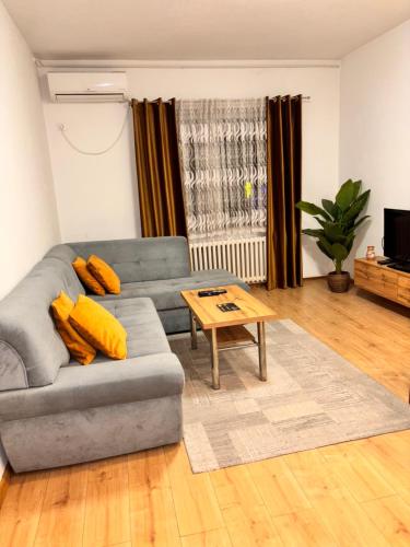 a living room with a couch and a table at R-RESIDENCY ll in Banja Luka