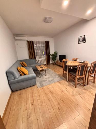 a living room with a couch and a table at R-RESIDENCY ll in Banja Luka