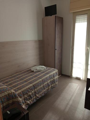 Postel nebo postele na pokoji v ubytování Hotel Bel Mare