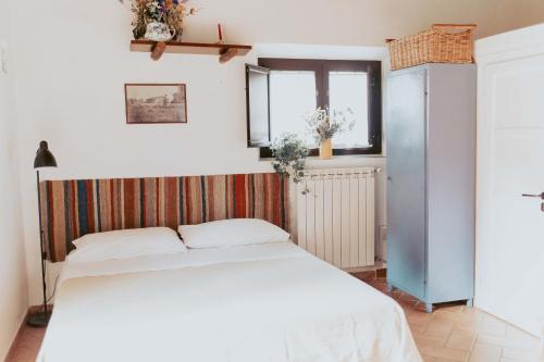 A bed or beds in a room at Bicoca - Casaletti