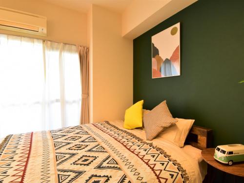 Cama o camas de una habitación en Alphabed福山西桜町