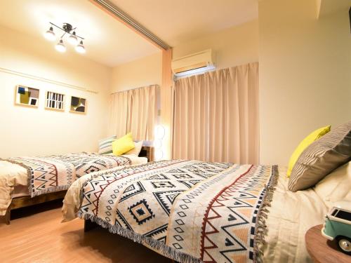 Cama o camas de una habitación en Alphabed福山西桜町