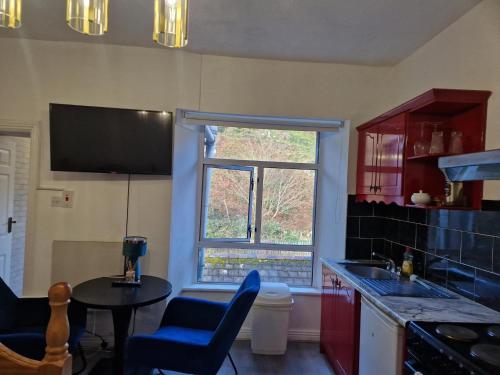 Kuchyň nebo kuchyňský kout v ubytování Cosy Cork Studio - cosyincork