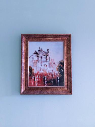 a picture of a painting of a building on a wall at Pod starymi lipami in Szczecin