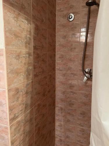 a bathroom with a shower with a glass door at Appartamento Giallo in Rio Marina