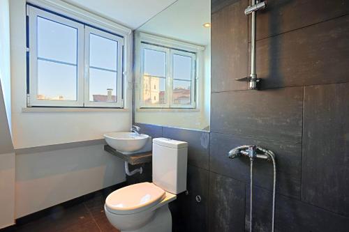 a bathroom with a toilet and a sink at Alfama 1 Terrace Lisboa Vida Boa in Lisbon