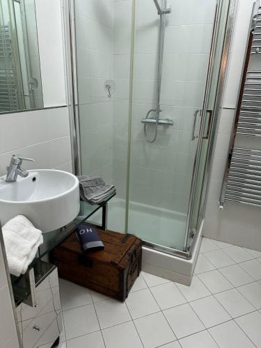 a bathroom with a sink and a shower at New apartment next to the beach in Laigueglia