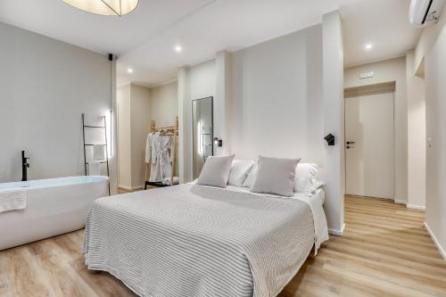 Postel nebo postele na pokoji v ubytování Welchome - Suites