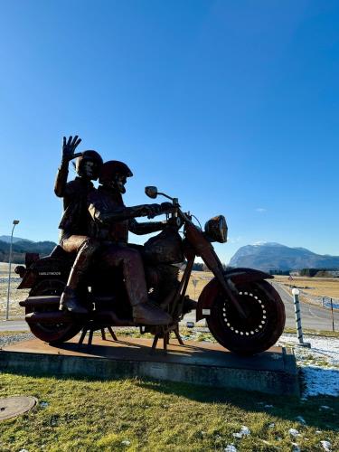a statue of three people riding a motorcycle at Nette Ferienwohnung in Seenähe in Oberaichwald