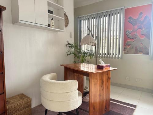 a desk and a chair in a room at Entire House inside Residential Area, Banilad Cebu in Cebu City