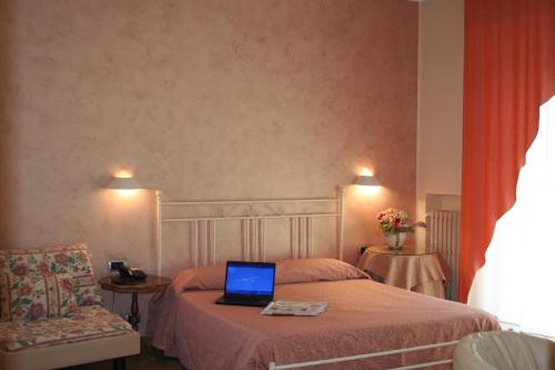 Postel nebo postele na pokoji v ubytování Hotel Diamante