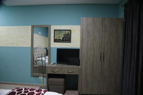 TV a/nebo společenská místnost v ubytování Prince Hotel Fier