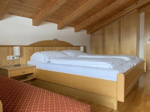 Postel nebo postele na pokoji v ubytování Penthouse Kurz