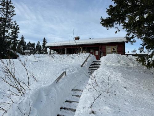 a snow covered staircase leading to a house at Trysilfjellet Nord 509 in Trysil
