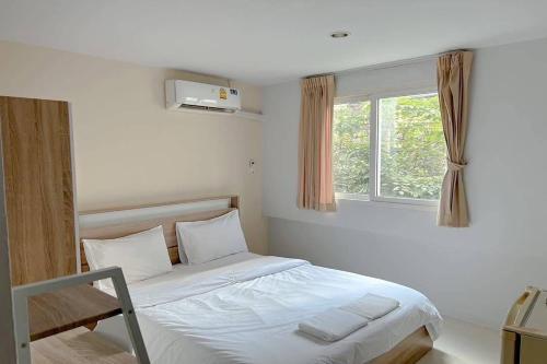 Postel nebo postele na pokoji v ubytování Cordia Residence Sathorn