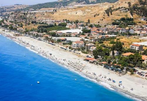 an aerial view of a beach in a resort at ToMa House in Pellaro