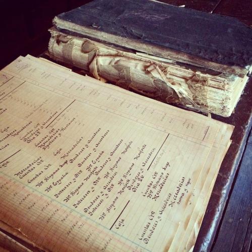 an old paper with writing on it in a box at Casa Histórica entre las Montañas in Quiroga