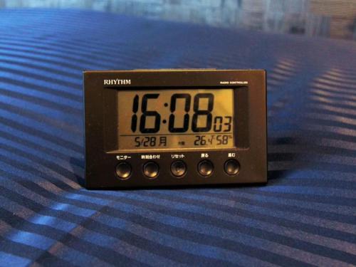 a clock sitting on top of a floor at HOTEL LiVEMAX Honhachinohe Ekimae in Hachinohe