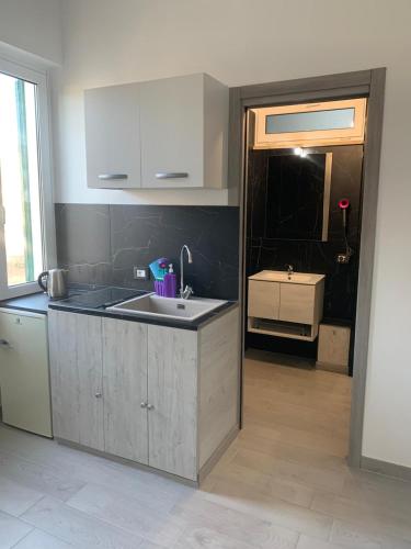 an empty kitchen with a sink and a sink at Santa Marinella Homes in Santa Marinella