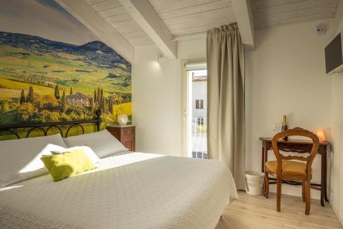 Postel nebo postele na pokoji v ubytování Acquamarina b&b