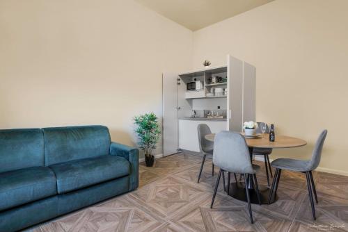 a living room with a couch and a table at B&B Le Stanze del Duomo in Florence