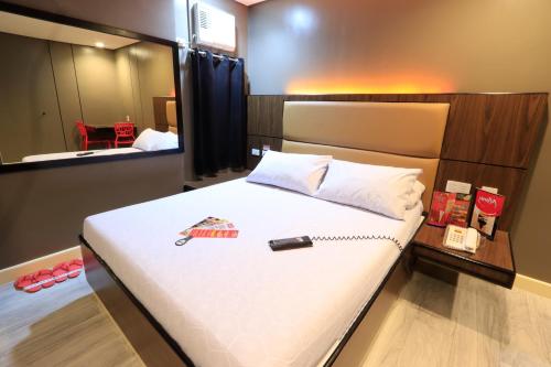 Postel nebo postele na pokoji v ubytování Hotel Sogo Fairview