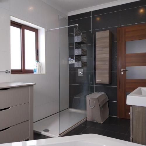a bathroom with a glass shower with a toilet and a sink at Luxury 9 person Holiday Home a walk to Paceville's nightlife in Is-Swieqi