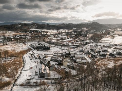 an aerial view of a town in the snow at Termy Karkonosze Resort & Spa koło Karpacza in Staniszów