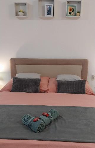 a pair of socks sitting on top of a bed at Repi-Tár apartman in Szolnok