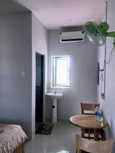 Ένα ή περισσότερα κρεβάτια σε δωμάτιο στο Nhà Nghỉ T&T