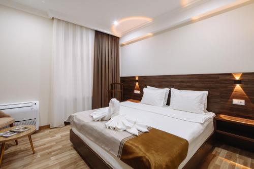 Katil atau katil-katil dalam bilik di Sofiya Tashkent Hotel