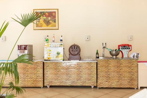a buffet in a room with a plant at Le Petit Palais Djerba & Spa in Houmt Souk