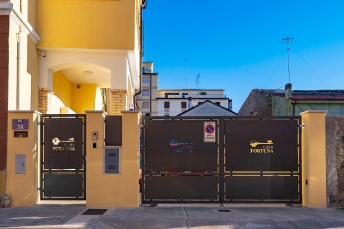 a group of gates in front of a building at Casa Fortuna in Monfalcone