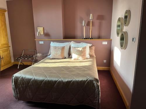 a bedroom with a bed and a chair in it at LeSable luxury vacation home in Kluisbergen