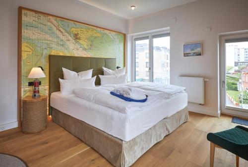 Postel nebo postele na pokoji v ubytování Hotel Villa Düne