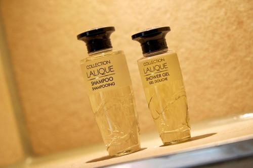 two bottles of soap sitting on a shelf at Hotel Villa Düne in Borkum