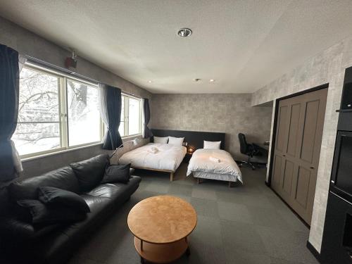 Letto o letti in una camera di Hakuba Third Place Lodge