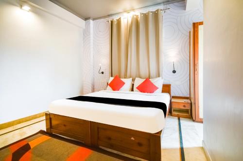 Ένα ή περισσότερα κρεβάτια σε δωμάτιο στο Collection O Hotel Urban Stays