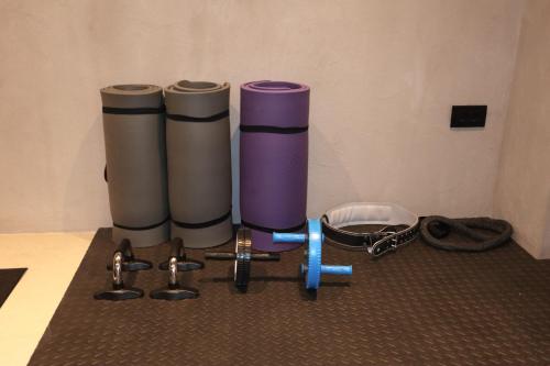 two cylindrical containers sitting on top of a table at Lithos Art Villas in Sarlata